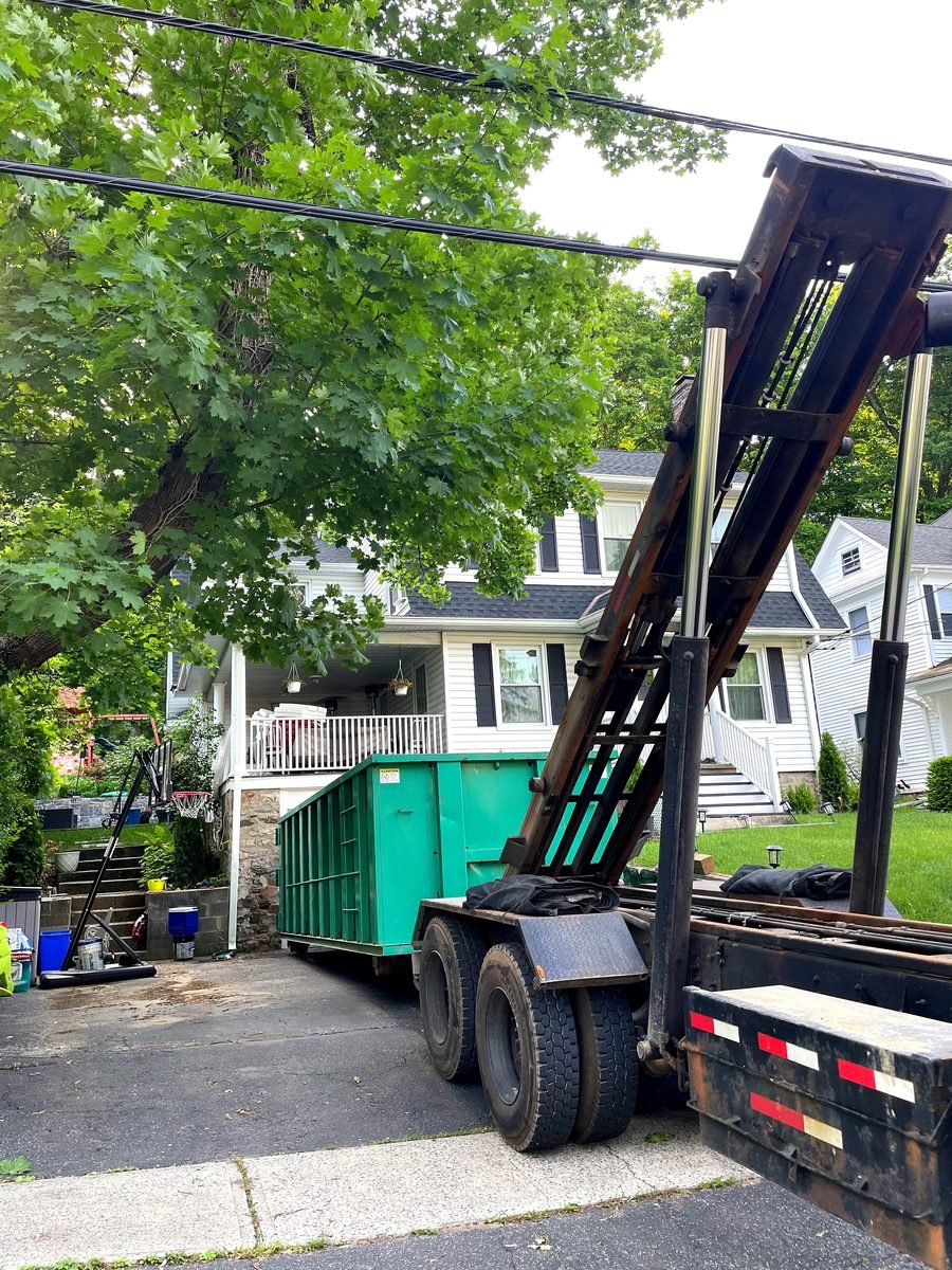 20 yard residential roll-off dumpster on driveway