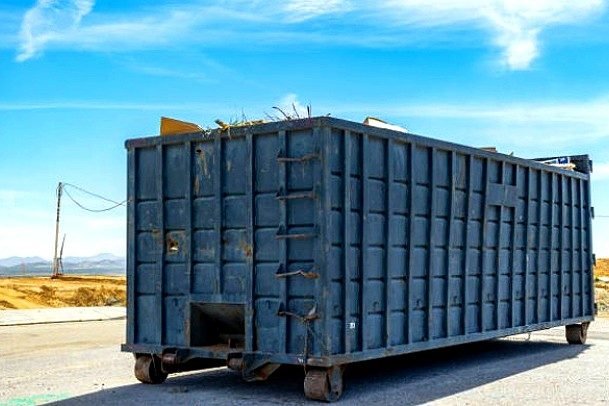 Orange Valley Environmental & Container Services roll-off container delivery on residential driveway in Orlando