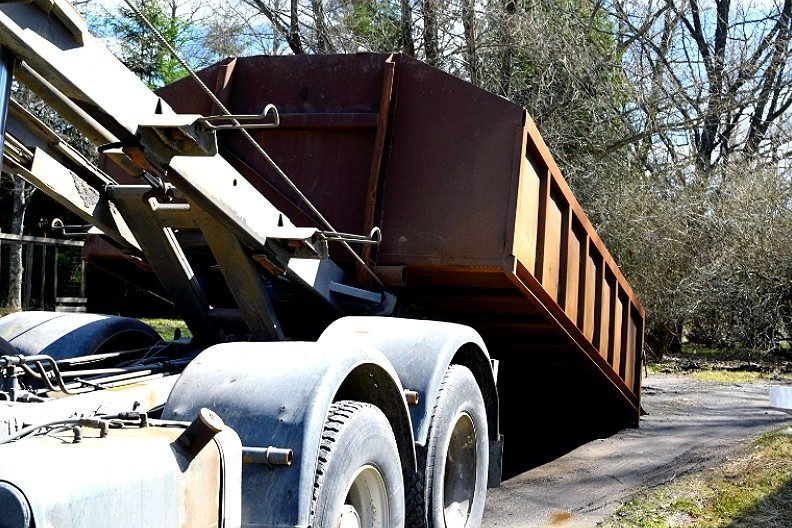 Midland Waste Logistics & Roll-Off Services heavy construction dumpster on job site in Kansas City
