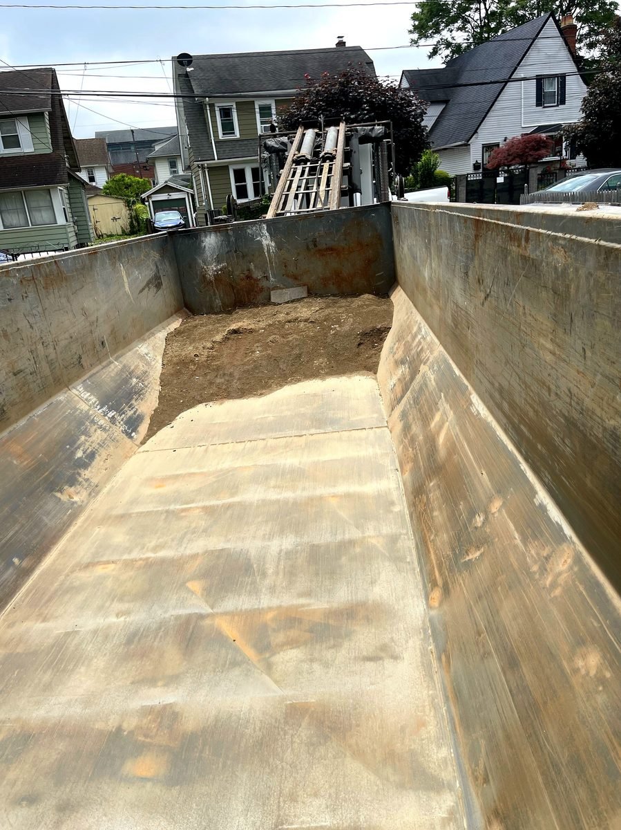 Old Dominion Waste & Roll-Off Services heavy construction dumpster on job site in Richmond