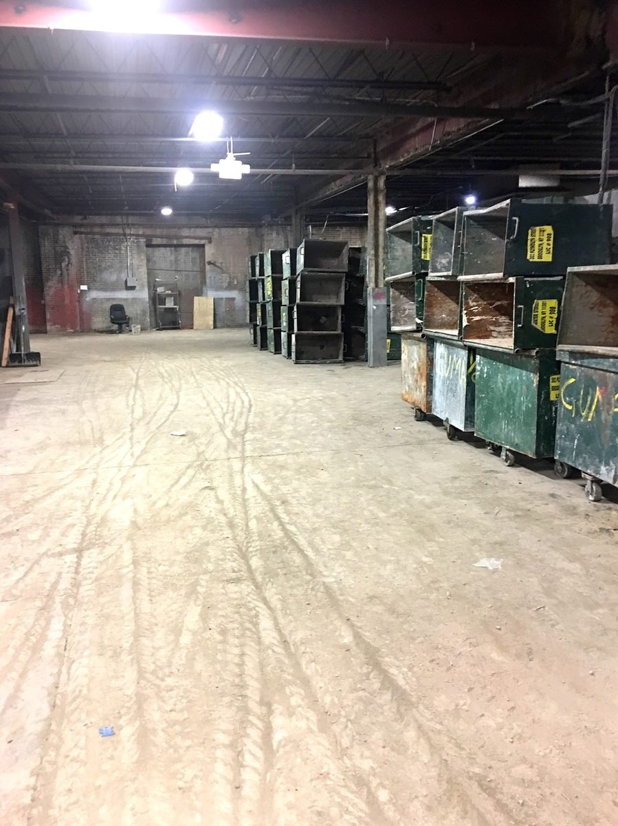 Front Range Waste & Roll-Off Services heavy construction dumpster on job site in Denver