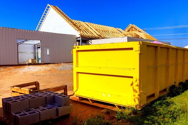 Hawkeye State Waste & Roll-Off Services heavy construction dumpster on job site in Des Moines