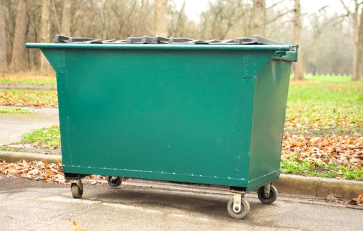 Sonoran Desert Waste & Roll-Off Services roll-off delivery truck and driver operating in Phoenix